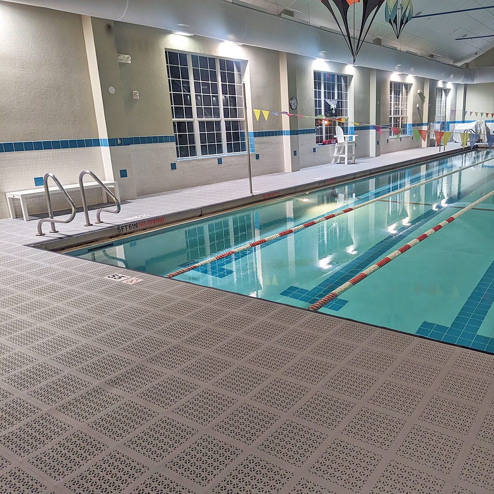light gray staylock waterproof deck tiles used as indoor pool flooring