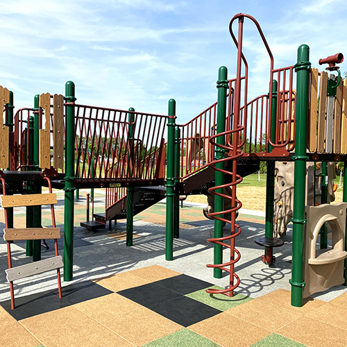 black green gray and orange rubber sterling tiles installed on playground