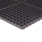 Industrial rubber TruTread Mat with drainage offers fatigue relief in wet areas.
