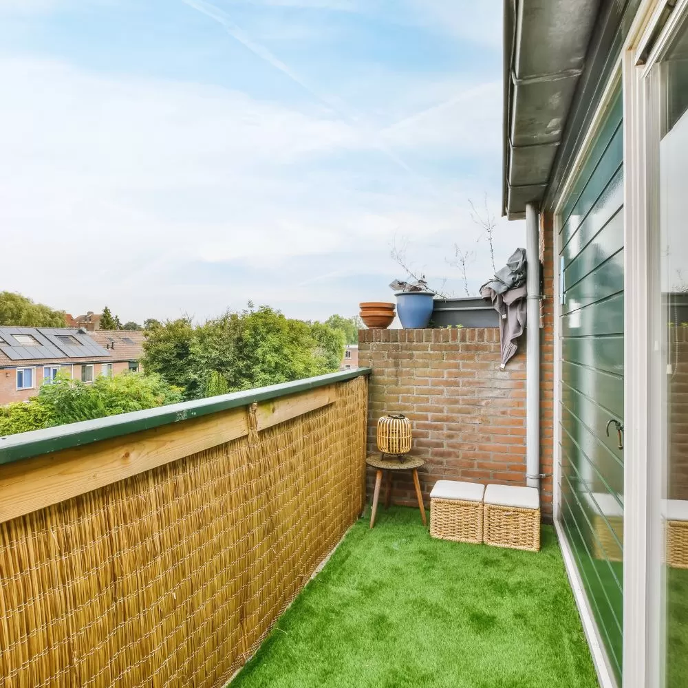 narrow balcony with artificial grass floor rug