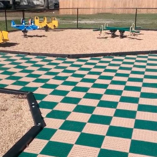 staylock perforated tiles install at church playground walkway