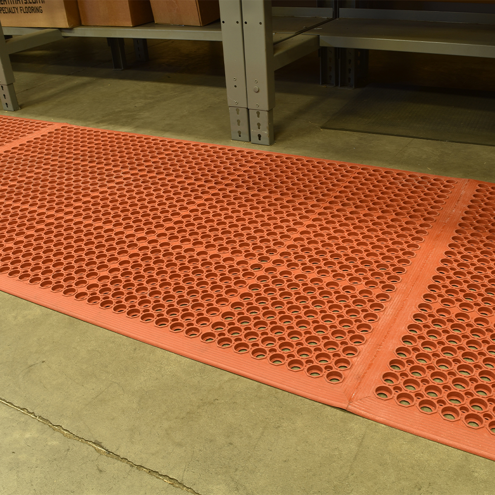 VIP Topdek Senior Red Mat 3 x 14 Feet 8 Inches over concrete next to workshop bench