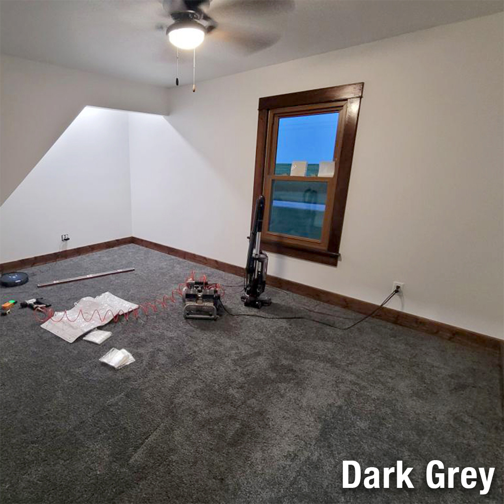 dark gray plush carpet tiles installation in bedroom 