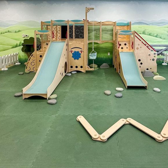 indoor playground for kids inside a cafe with foam mat flooring