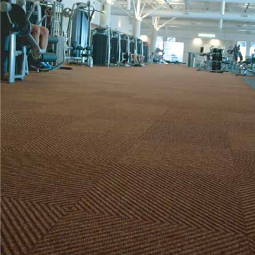 brown carpet tiles with diagonal ribbed texture in fitness center