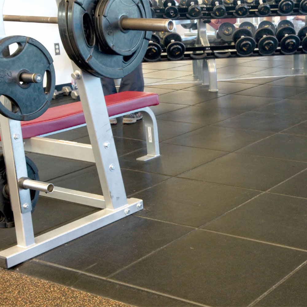  UltraTile Rubber Weight Floor tiles installed in gym with floor reducer