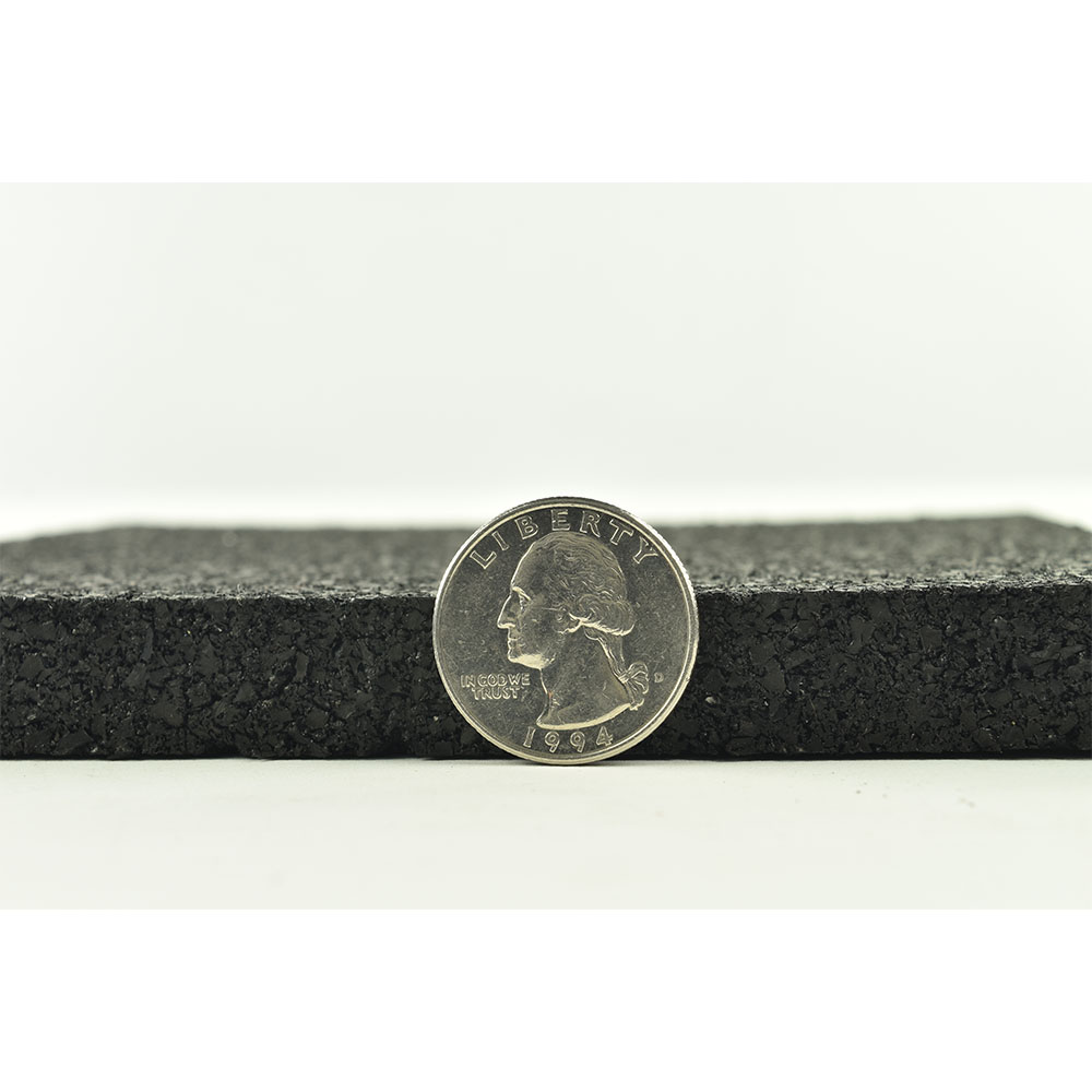 Impact Zone Lifting Platform Rubber Roll showing thickness with quarter comparison