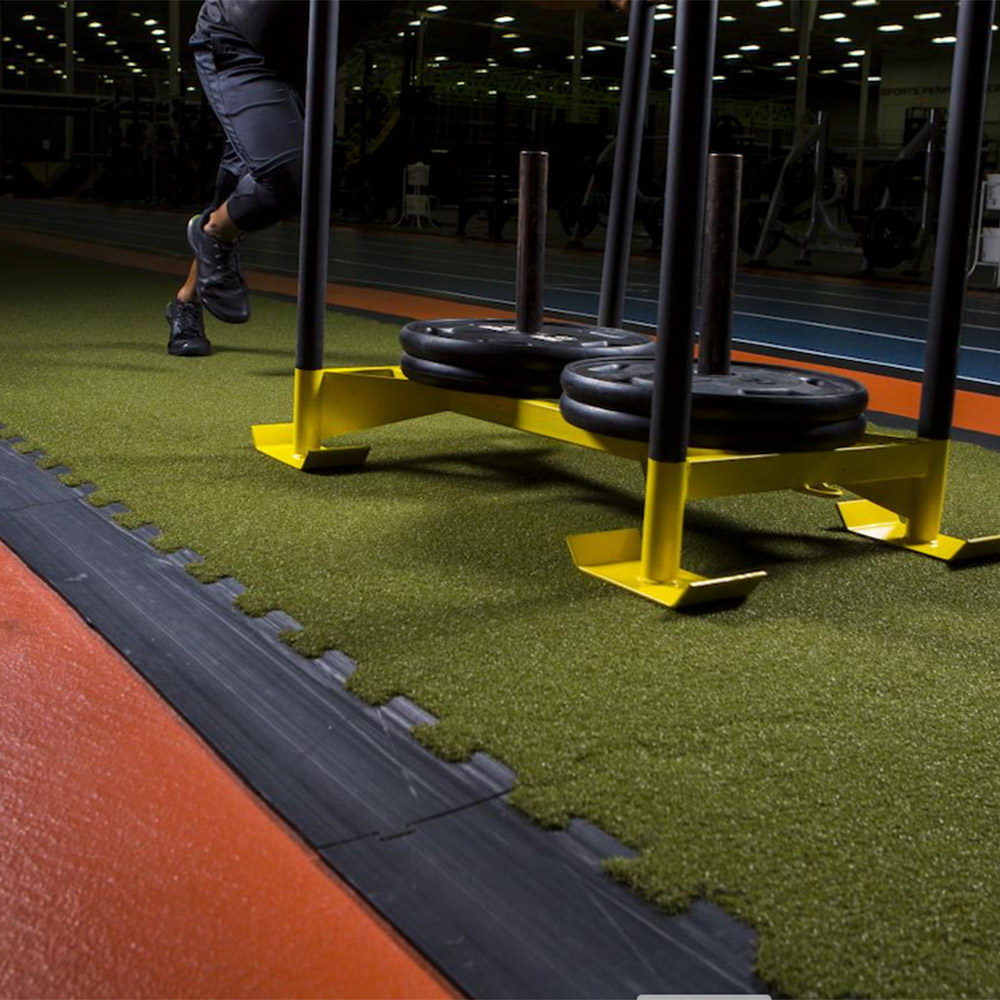 turf tile with weight sleds