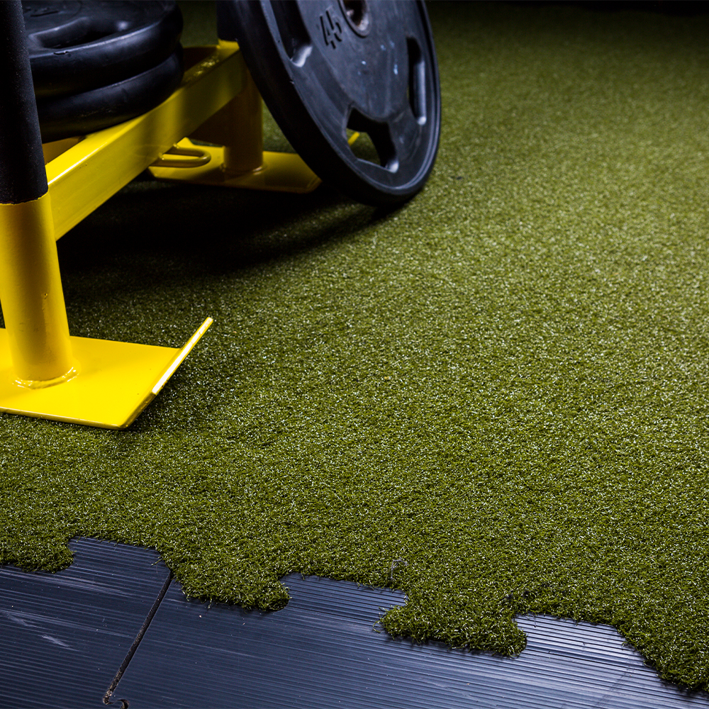 modular turf tiles used in commercial gym for sled practice