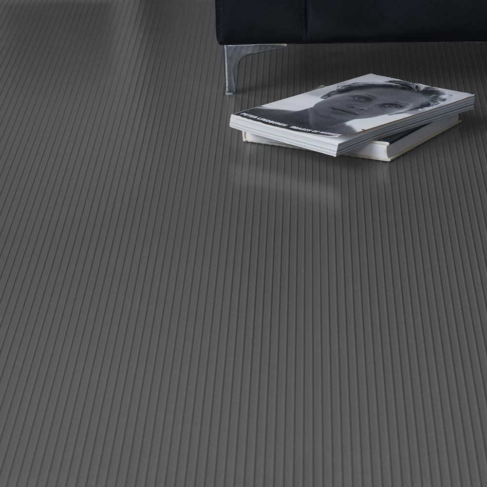 G-Floor Ribbed Tread Garage Floor Roll 55 mil x 7.6x17 Ft. in slate gray with sofa and magazines