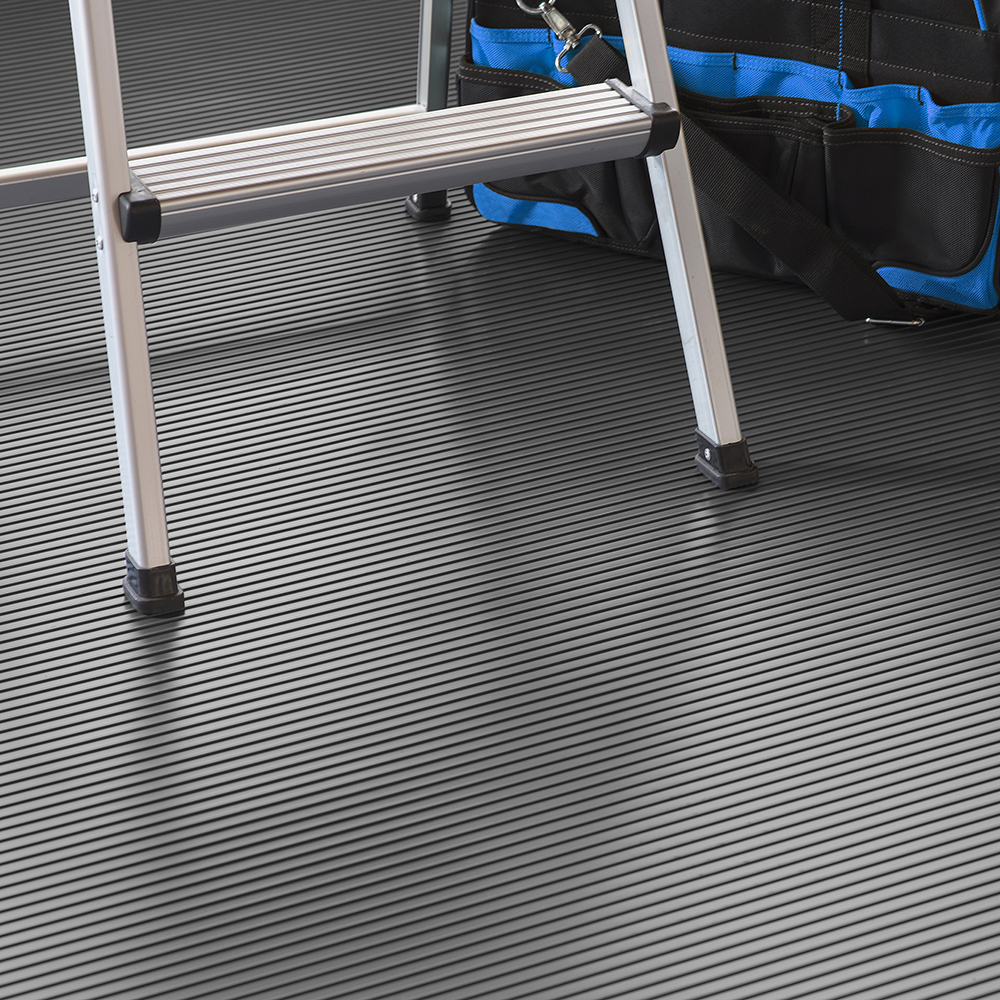 Tool bag and ladder on G-Floor Ribbed Tread Garage Floor Roll 55 mil x 7.6x17 Ft. in slate gray