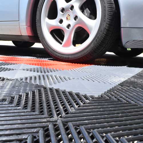 Perforated Click Garage Tile Floor under Porsche