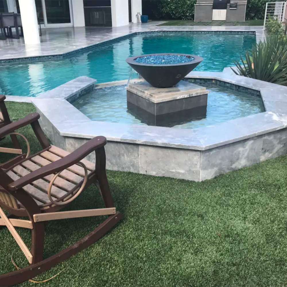 artificial turf installed around small outdoor pool