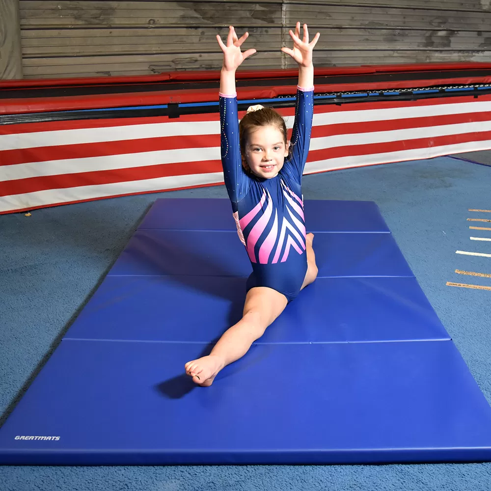 blue folded out mat with gymnast