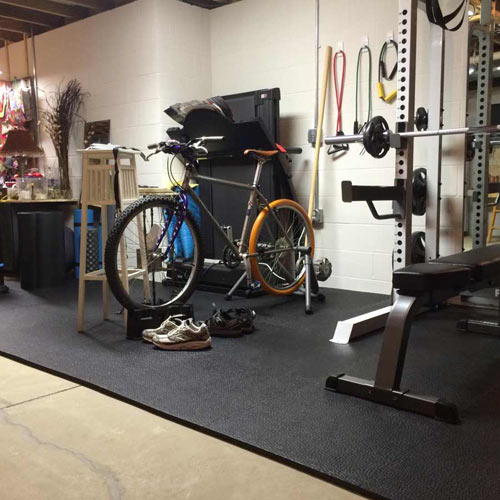 Home gym flooring over concrete floor in basements