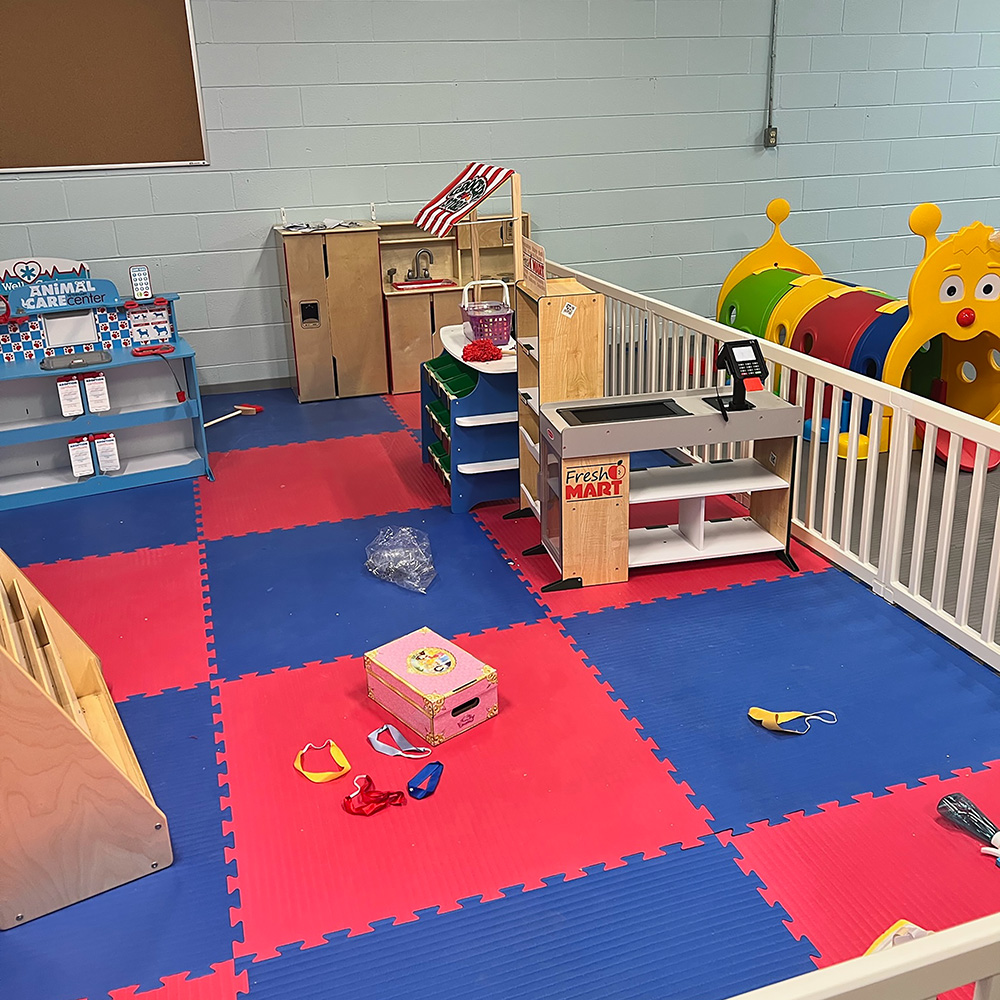 red and blue foam floor mats for indoor playground at daycare