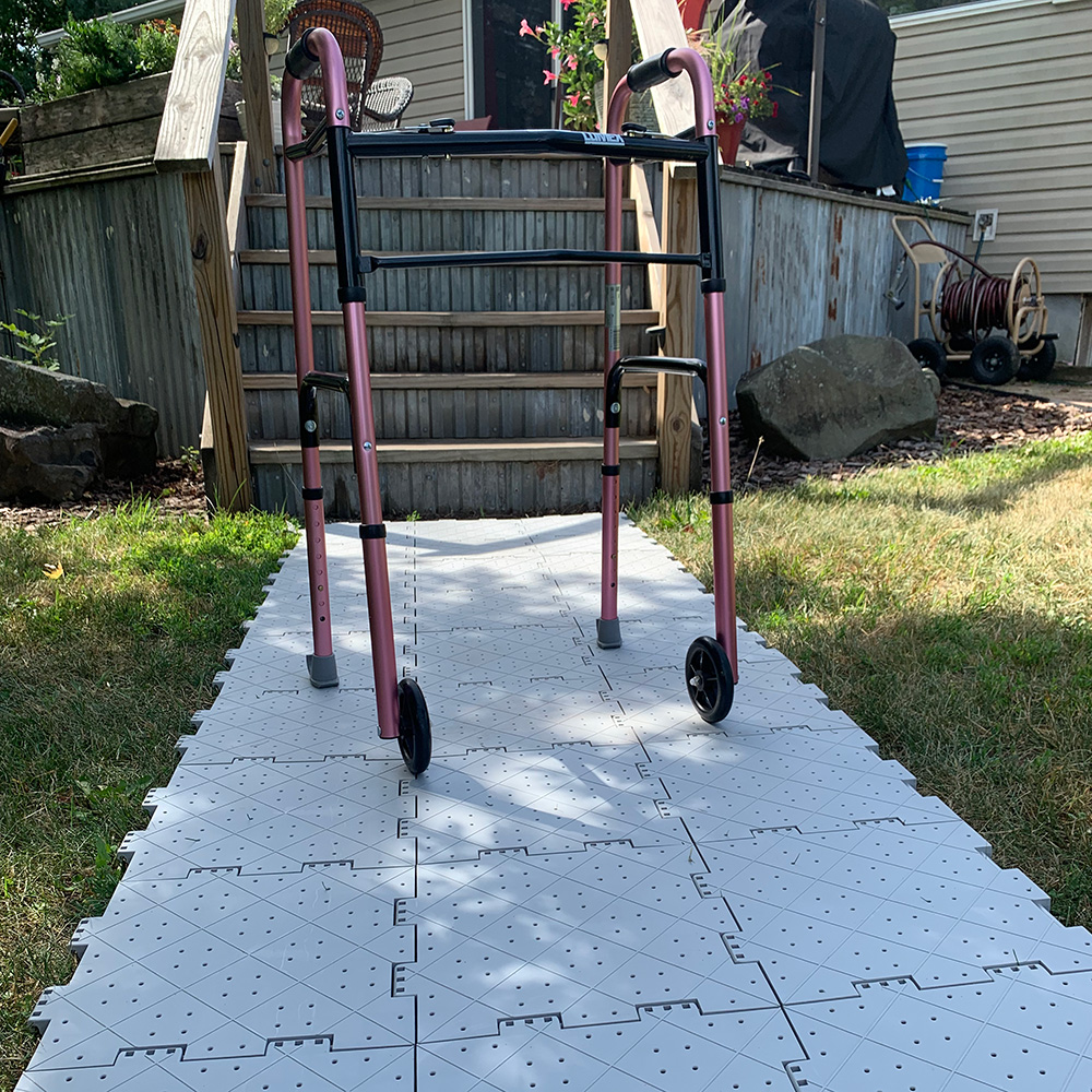 temporary outdoor sidewalk over grass for handicap accessible with walker