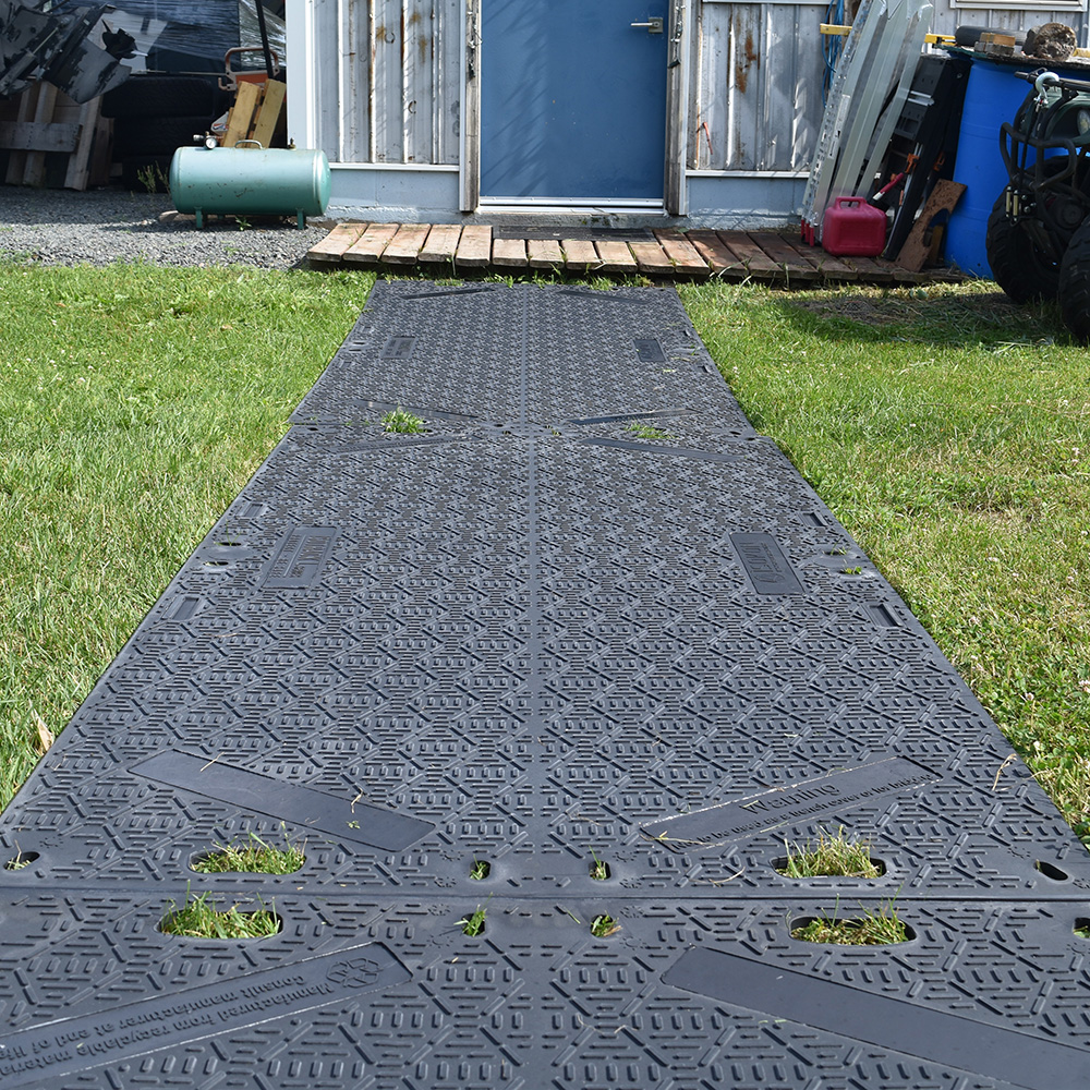 temporary outdoor walkway ground protection mats over grass