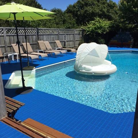 interlocking blue outdoor swimming pool deck tiles over concrete