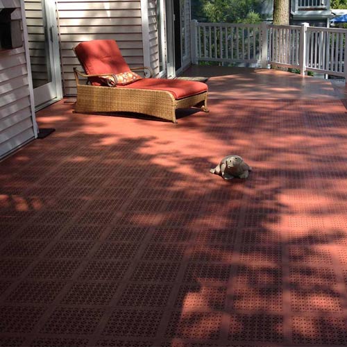 plastic decking tiles over top of wood deck