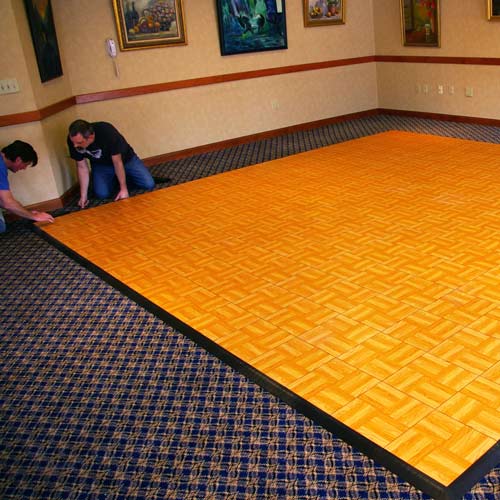 https://www.greatmats.com/images/portable-dance-floor/portable-dance-floor-tiles-hotel-install1.jpg