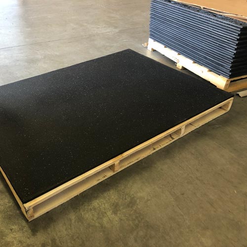 For those on hard flooring. Horse stall mat from tractor Supply, 65 bucks  for a 4x8 inch thick rubber mat cut to fit. Night and day difference on  vibration noise from my