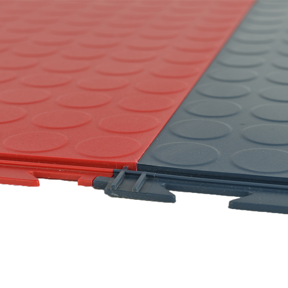close up of red and blue tuffseal interlocking tiles showing interlocking connections