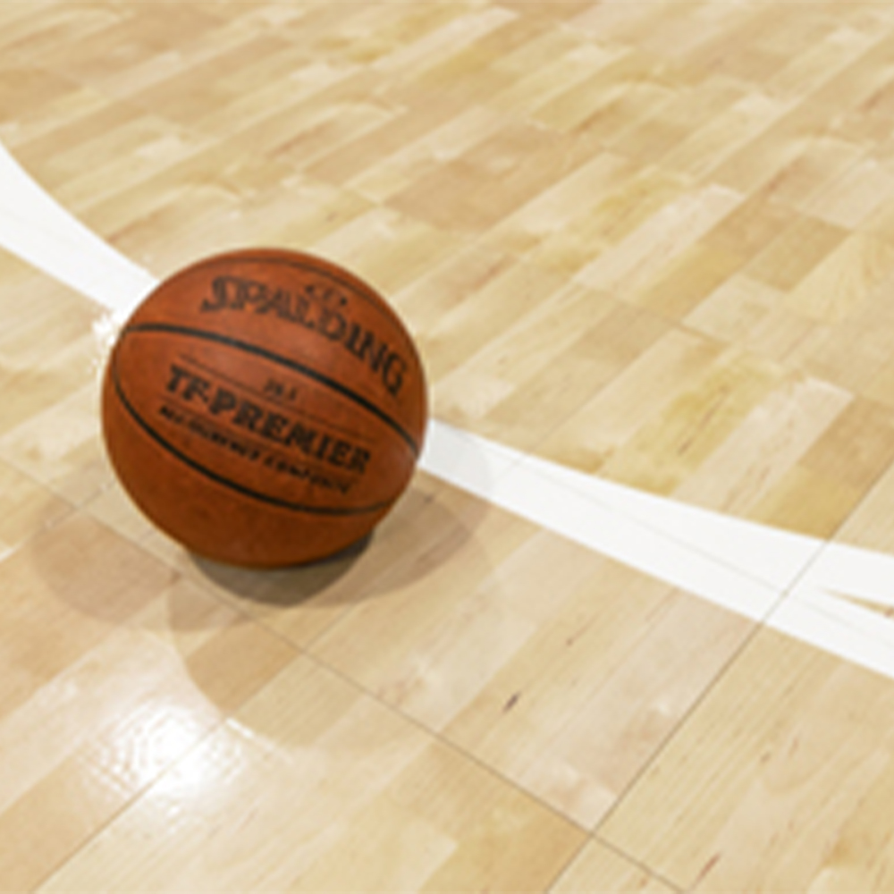 Basketball on VersaCourt Pro Wood Grain Court Tile 1/2 Inch x 12x12 Inches