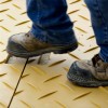 Blue Gator Ground Protection Diamond Mat 1/2 Inch x 4x8 Ft. worker walking on mat