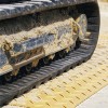 Blue Gator Lite Ground Protection Diamond Mat Tan 3/8 Inch x 4x8 Ft. driving on with rubber tracks