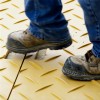 Walking on Blue Gator Lite Ground Protection Diamond Mat Tan 3/8 Inch x 4x8 Ft.