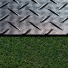 Close up of the diamond texture of the Ground Protection Mats 4x8 Ft