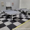 light and dark gray carpet tiles in game room with ping pong tables