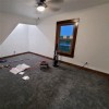 dark gray plush carpet tiles installation in bedroom 