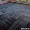 Reverb Commercial Carpet Tiles in chili red color installed in quarter turn pattern