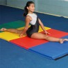 Girl practicing on Foldable Gym Mat Medium Firm Foam 4x10 Ft. x 2 Inch V4 in Rainbow colors