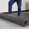 Unrolling G-Floor Lite Diamond Tread Garage Floor Roll 45 mil x 7.6x14 Ft. in slate gray