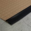 Midnight black G-Floor Garage Floor Edge Trim 3.25 Inch Wide x 25 Ft. installed on coin top floor in sandstone