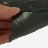 Corner curled up of G-Floor Lite Diamond Tread Garage Floor Roll 45 mil x 7.6x14 Ft. in midnight black