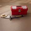 Tools and box on G-Floor Ribbed Tread Garage Floor Roll 55 mil x 8.6x22 Ft. in sandstone