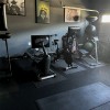 garage gym with equipment and plyometric rubber flooring