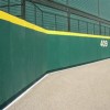 Outdoor Field Wall Padding for Chain Link Fences with Graphics 7x4 ft green pad.