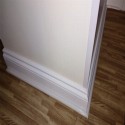 wood grain foam tiles floor in bedroom with decorative trim
