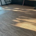wood grain interlocking tiles in sun room