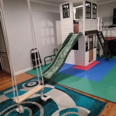 indoor kids play area in living room with green and blue foam 