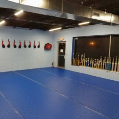 clear tape used on blue martial arts roll out mats